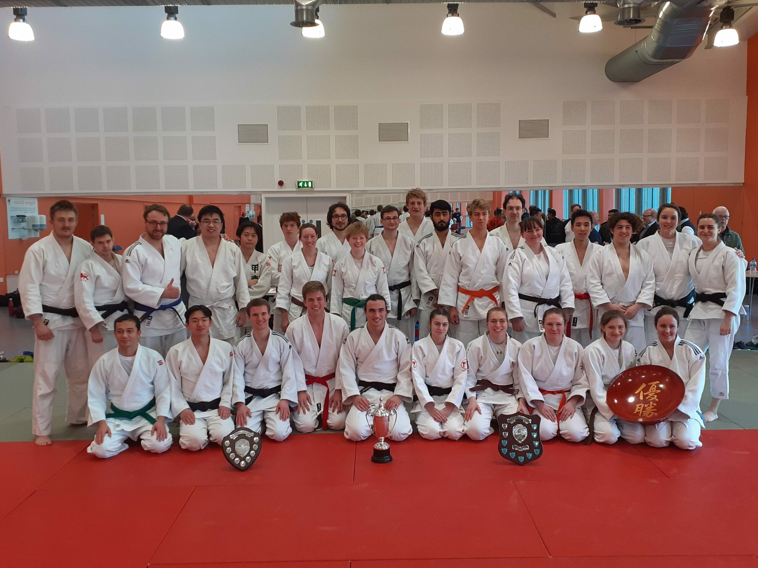 Varsity 2022 Cambridge judo teams pose with trophies